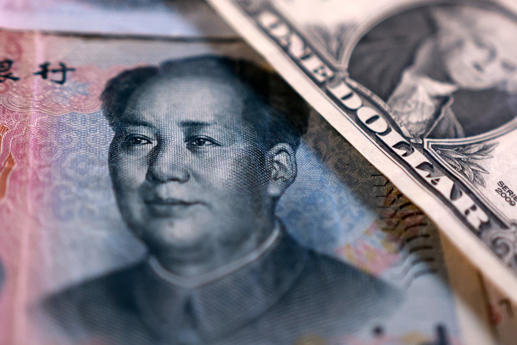 U.S. dollar and Chinese Yuan banknotes are seen in this illustration taken September 12, 2025. REUTERS/Dado Ruvic/Illustration