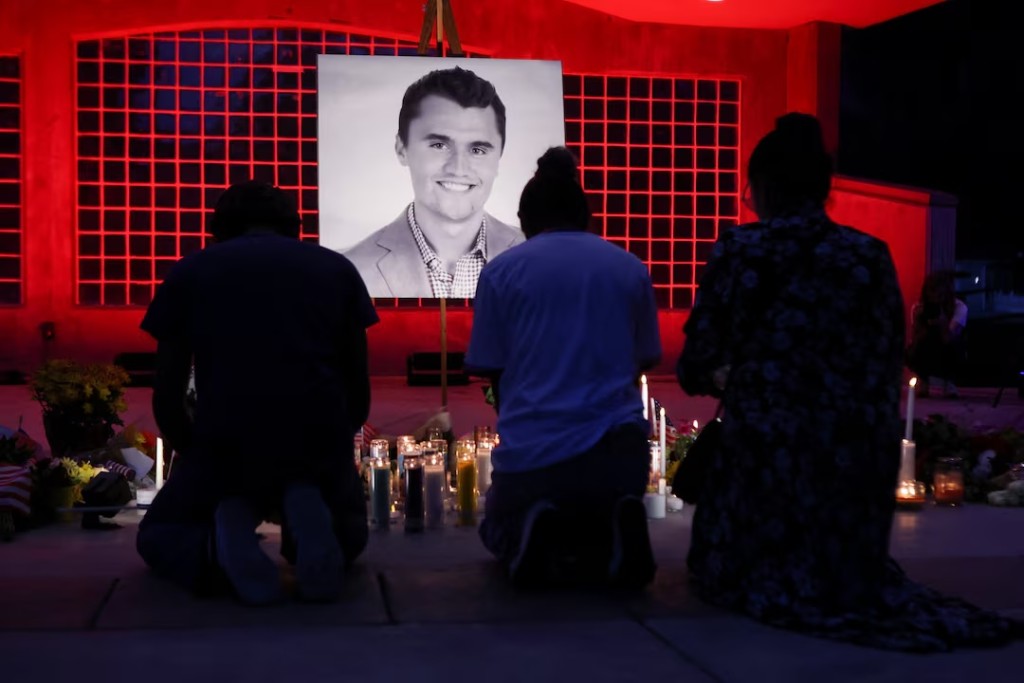 People pay their respects during a vigil at Orem City Center Park, after U.S. right-wing activist and commentator, Charlie Kirk, an ally of U.S. President Donald Trump, was fatally shot during an event at Utah Valley University, in Orem, Utah, U.S. September 11, 2025. REUTERS/Jim Urquhart 