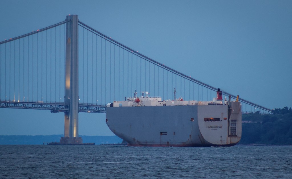 Photo by KENA BETANCUR / AFP The London Highway vehicle carrier departs from Port Newark as seen from Bayonne, New Jersey on July 24, 2026.