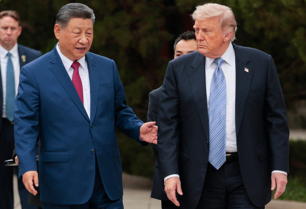 US President Donald Trump (R) walks with China’s President Xi Jinping (L) as he leaves after a visit to Zhongnanhai Garden in Beijing on May 15, 2026. (Photo by Evan Vucci / POOL / AFP) US President Donald Trump (R) walks with China’s President Xi Jinping (L) as he leaves after a visit to Zhongnanhai Garden in Beijing on May 15, 2026. (Photo by Evan Vucci / POOL / AFP)