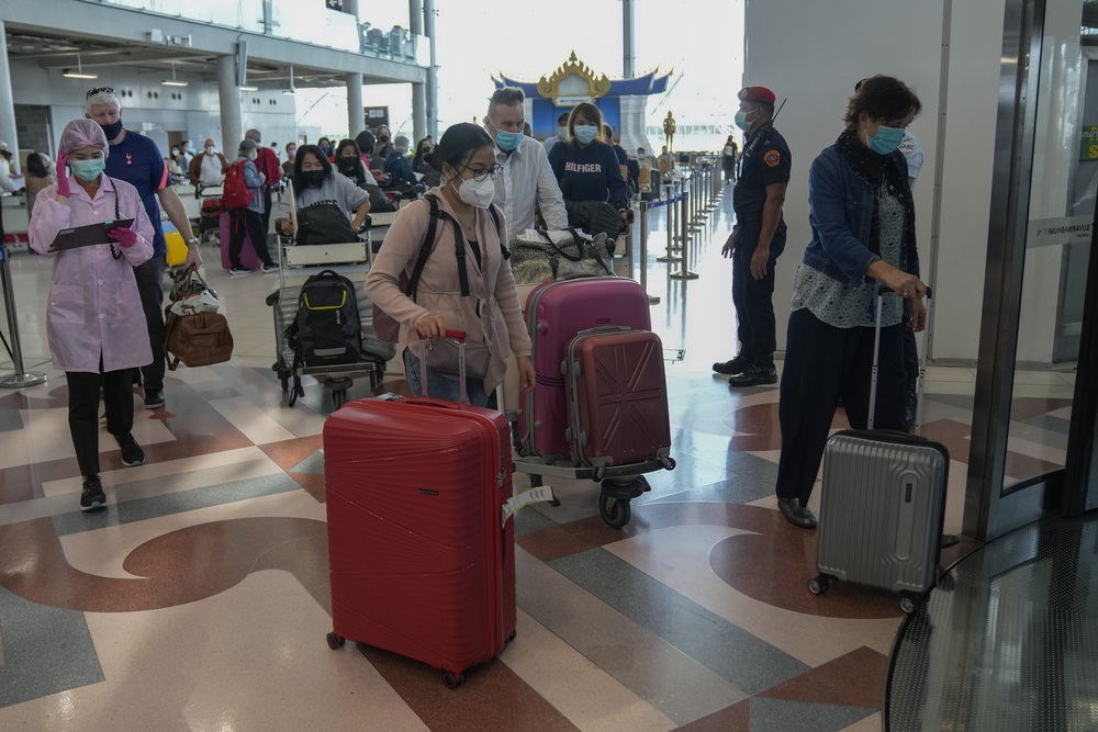 Tourists arrive at Suvarnabhumi International Airport in Bangkok, Thailand. (AP Photo) Tourists arrive at Suvarnabhumi International Airport in Bangkok, Thailand. (AP Photo)