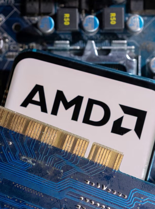 A smartphone with a displayed AMD logo is placed on a computer motherboard in this illustration taken March 6, 2023. REUTERS