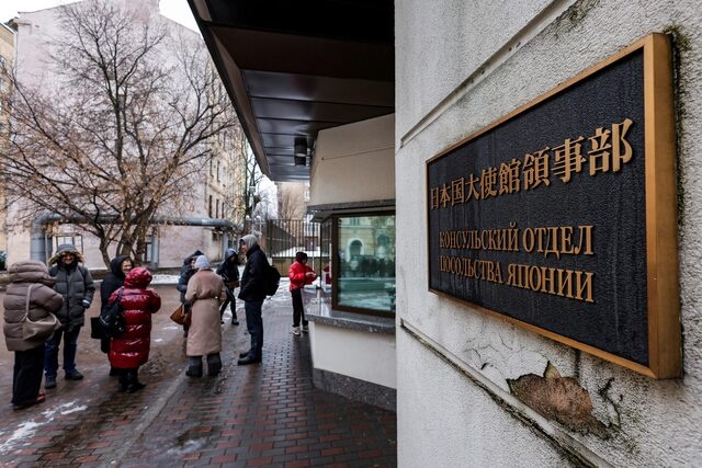 People queue to apply for visas at the Japanese embassy in Moscow, Russia March 4, 2025. A sign reads: "Consular department at Japanese embassy". REUTERS/Maxim Shemetov/File Photo