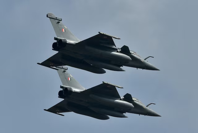 Indian Air Force's Rafale fighter jets fly past during the "Aero India 2021" air show at Yelahanka air base in Bengaluru, India, February 3, 2021. REUTERS/Samuel Rajkumar/File Photo