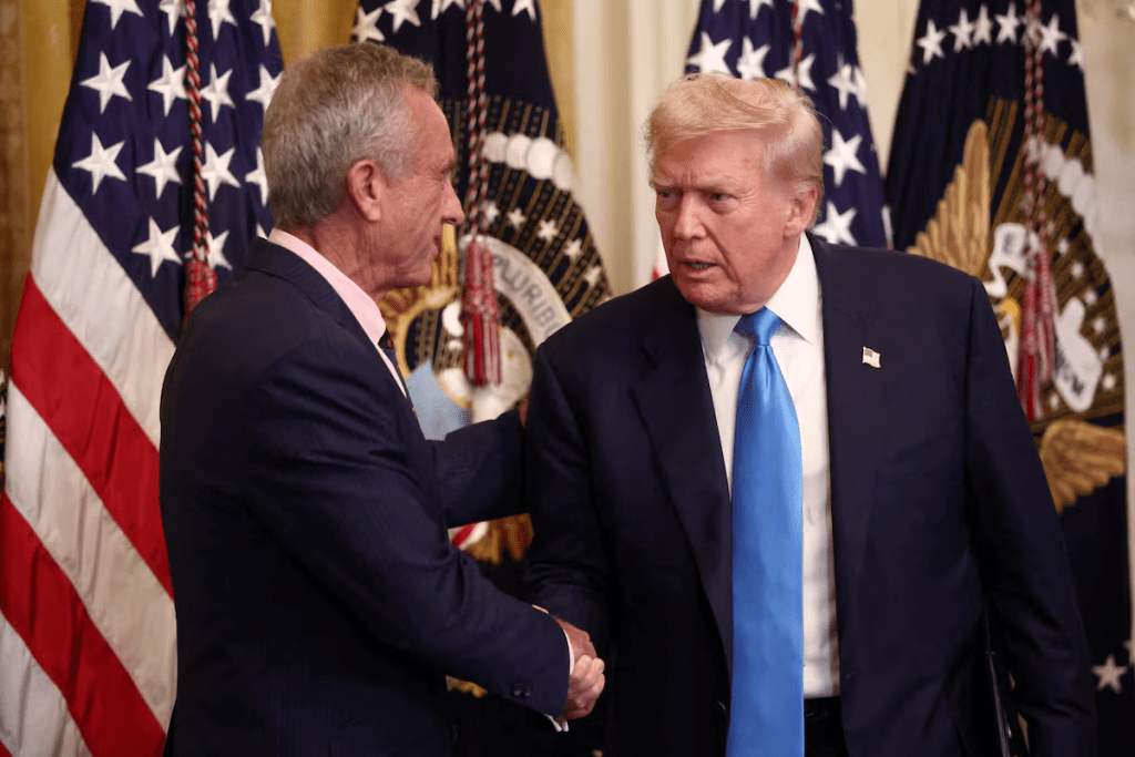 U.S. President Donald Trump shakes hands with U.S. Health and Human Services (HHS) Secretary Robert F. Kennedy, Jr., during the "Making Health Technology Great Again" event in the East Room at the White House in Washington, D.C., U.S., July 30, 2025. REUTERS/Evelyn Hockstein/File Photo
