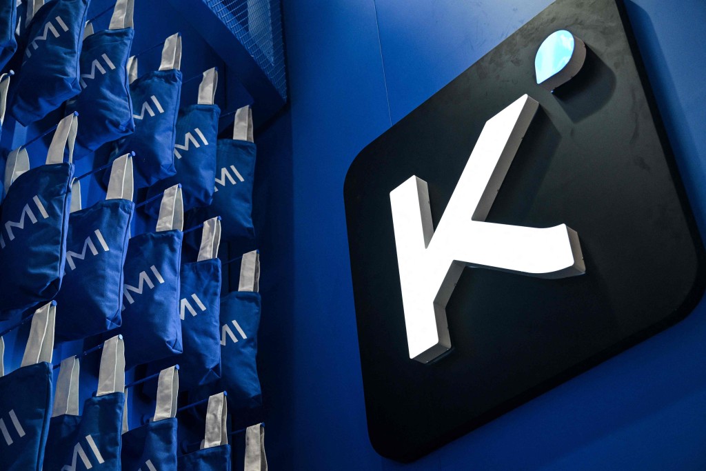 A Kimi logo is pictured at the Moonshot AI stand, featuring the Kimi K3 model, during the World Artificial Intelligence Conference (WAIC) in Shanghai on July 18, 2026. (Photo by HECTOR RETAMAL / AFP)