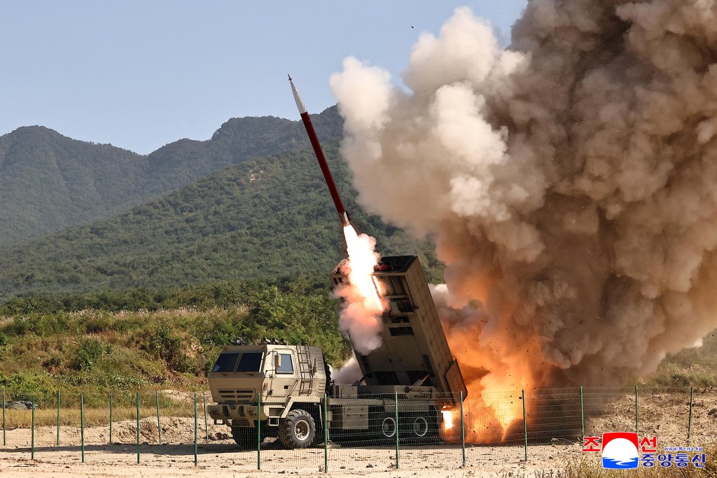 This picture taken on September 22, 2026 and released by North Korea's official Korean Central News Agency (KCNA) on September 24, 2026, shows the test-firing of an upgraded 240mm guided rocket at an undisclosed location in North Korea. (Photo by KCNA / KCNA VIA KNS / AFP)
