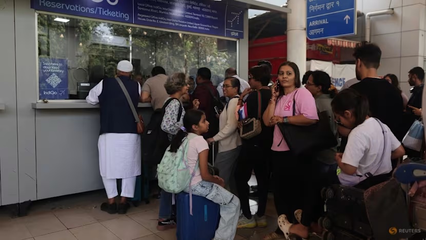 Passengers wait outside the IndiGo airlines' ticket counter after several flights were cancelled at Mumbai Airport Terminal 1 in Mumbai, India, on Dec 5, 2025. (Photo: Reuters/Francis Mascarenhas)