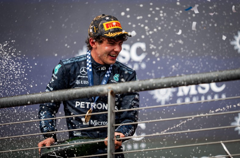 Kimi Antonelli celebrates on the podium after his victory in the United States Grand Prix at the Circuit of The Americas. AFP