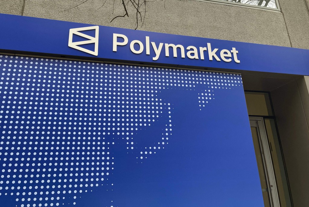 The logo of the prediction market online platform Polymarket is seen outside their new location called "The Situation Room" during its opening day in Washington, DC, on March 20, 2026. AFP