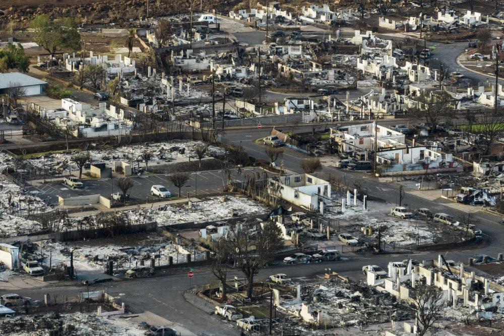 Residents of razed Hawaii city may not be able to afford to live there when its rebuilt . (AP) Residents of razed Hawaii city may not be able to afford to live there when its rebuilt . (AP)