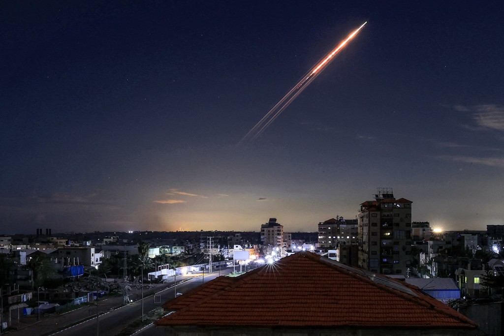 A missile launched from Iran is pictured in the sky from the Bureij camp for Palestinian refugees in the central Gaza Strip on March 1, 2026. (AFP)