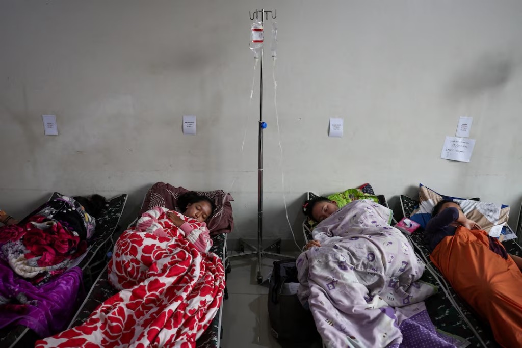 Students rest while receiving treatments for food poisoning after eating government-sponsored free school meals, at Cililin regional hospital in Bandung, West Java province, Indonesia, September 25, 2025. REUTERS/Willy Kurniawan