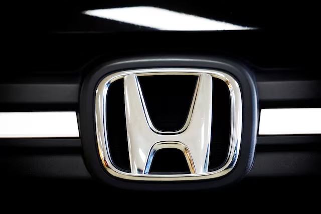 A logo of Honda is seen inside a car dealer in Nijmegen, Netherlands February 26, 2025. REUTERS/Piroschka van de Wouw