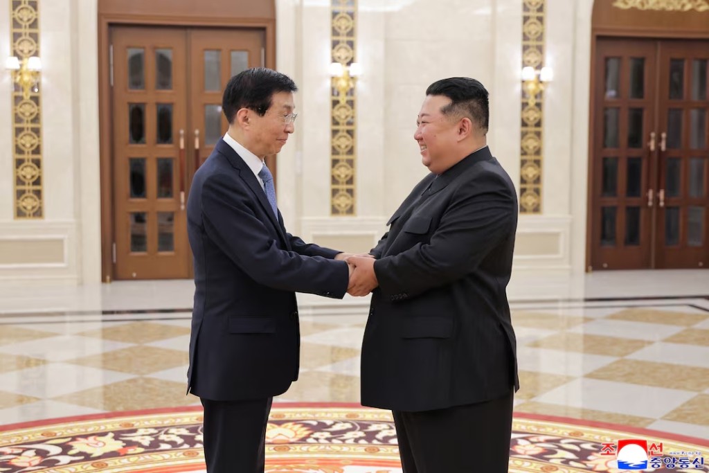 North Korean leader Kim Jong Un shakes hands with Chinese People's Political Consultative Conference Chairman Wang Huning, during Wang's visit in Pyongyang, North Korea, July 16, 2026 in this picture released July 17, 2026 by North Korea's official Korean Central News Agency. KCNA via REUTERS