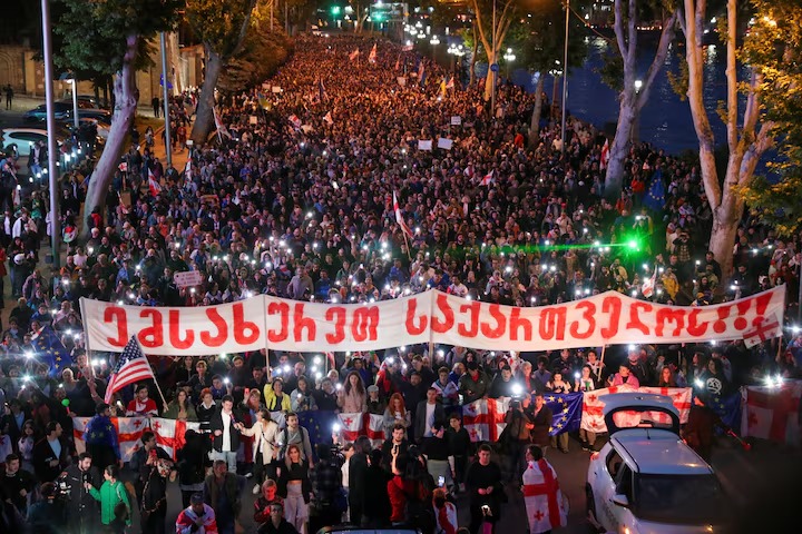 Demonstrators take part in a procession to protest against a bill on 'foreign agents'. (Reuters) Demonstrators take part in a procession to protest against a bill on 'foreign agents'. (Reuters)