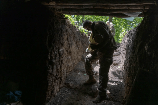A Ukrainian serviceman of the 127th Territorial Defence Brigade carries a shell to fire KS-19 100mm gun towards Russian positions near Kharkiv, Ukraine, Friday, May 16, 2025. (AP Photo/Yevhen Titov)[ASSOCIATED PRESS/Yevhen Titov]