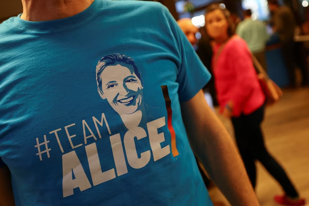 An attendee wears a T-shirt supporting Alternative for Germany party (AfD) co-leader Alice Weidel at an AfD election campaign event in Neu-Isenburg, Germany, February 1, 2025. REUTERS/Kai Pfaffenbach/File Photo An attendee wears a T-shirt supporting Alternative for Germany party (AfD) co-leader Alice Weidel at an AfD election campaign event in Neu-Isenburg, Germany, February 1, 2025. REUTERS/Kai Pfaffenbach/File Photo