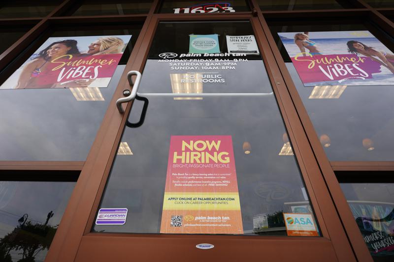 A Now Hiring sign at a business in Richmond, Virginia, Wednesday, June 2, 2021. 