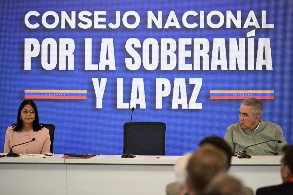 Venezuela's Vice President Delcy Rodriguez (L) and deputy Luis Eduardo Martinez attend a meeting with accredited diplomatic representatives in Caracas on September 29, 2025. Venezuelan President Nicolas Maduro is ready to declare a state of emergency over the threat of US "aggression" following a spate of deadly US strikes on suspected Venezuelan drug boats, Vice President Delcy Rodriguez said on Monday. (Photo by Juan BARRETO / AFP)