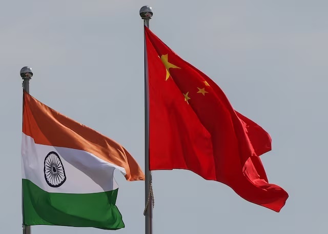 National flags of China and India fly next to the Meijiang Convention and Exhibition Center, a venue for 2025 Shanghai Cooperation Organisation (SCO) summit in Tianjin, China August 30, 2025. REUTERS/Maxim Shemetov  