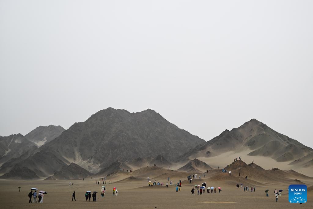 Tourists visit the Heidu Mountain in Lenghu Town, Mangnai City of Haixi Mongolian and Tibetan Autonomous Prefecture of northwest China's Qinghai Province, July 30, 2025. Xinhua