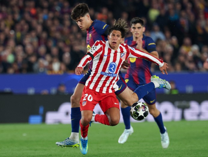 Pau Cubarsi barges into Giuliano Simeone and is sent off after a VAR review. AFP