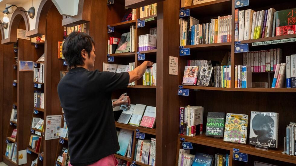 Rokurou Yui, who runs three shelf-sharing bookstores, at his bookstore in Tokyo's Kanda Jimbocho district © Kazuhiro NOGI / AFP Rokurou Yui, who runs three shelf-sharing bookstores, at his bookstore in Tokyo's Kanda Jimbocho district © Kazuhiro NOGI / AFP