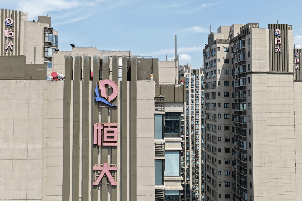 Evergrande Group logos are seen on apartment buildings in Nanjing, China's eastern Jiangsu province on August 25, 2025. Embattled property giant China Evergrande Group said on August 12 it will delist from Hong Kong Stock Exchange as a heavier-than-expected debt burden weighed on its liquidation process. (Photo by AFP) 