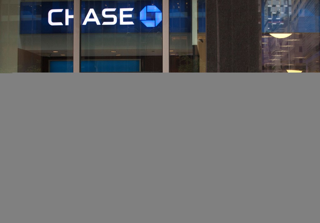 A customer exits the lobby of JPMorgan Chase & Co. headquarters in New York May 14, 2012. REUTERS/Eduardo Munoz/File Photo