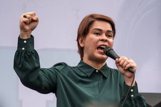Philippine Vice President Sara Duterte gestures as she speaks to supporters on stage after the postponement of her arraignment, outside the Quezon City Hall in Quezon City, Philippines, September 11, 2026. REUTERS/Lisa Marie David/ File Photo