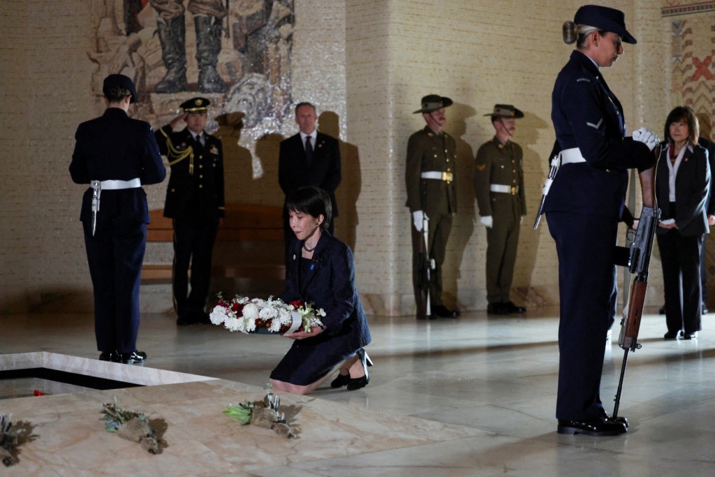 Japan's Prime Minister Sanae Takaichi lays a wreath on the Tomb of the Unknown Australian Soldier, in Canberra, Australia, May 4, 2026. (Reuters)