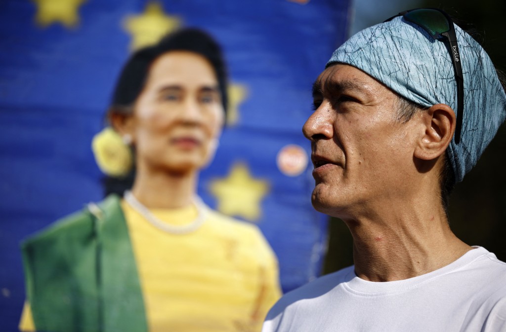 Photo by BENJAMIN CREMEL / AFP Kim Aris, son of Aung San Suu Kyi, speaks to supporters before taking part in a run on his mother's 80th birthday, to raise awareness of her ongoing incarceration, in Hyde Park in London on June 19, 2025.