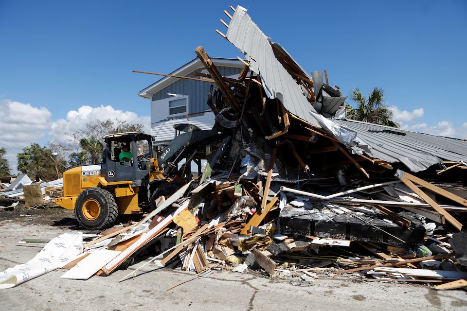 A man operating a front loader clears a home from the road that was destroyed in Keaton Beach after Hurricane Helene passed through the Florida panhandle, severely impacting the community in Keaton Beach, Florida, U.S., September 29, 2024. (Reuters) A man operating a front loader clears a home from the road that was destroyed in Keaton Beach after Hurricane Helene passed through the Florida panhandle, severely impacting the community in Keaton Beach, Florida, U.S., September 29, 2024. (Reuters)