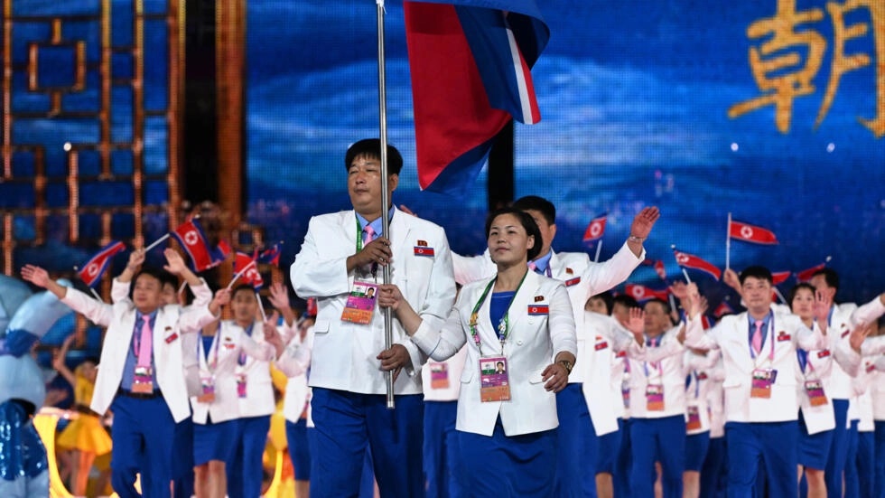 North Korea's flag was carried into the opening ceremony of the Asian Games. (AFP) North Korea's flag was carried into the opening ceremony of the Asian Games. (AFP)