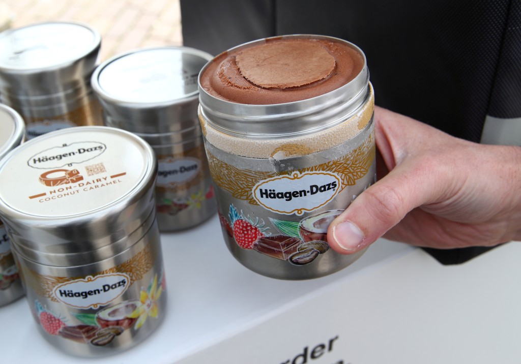 A staff displays a reusable container of Haagen Dazs ice cream before the opening of the 152nd Annual General Meeting of Nestle in Lausanne, Switzerland April 11, 2019. REUTERS/Denis Balibouse