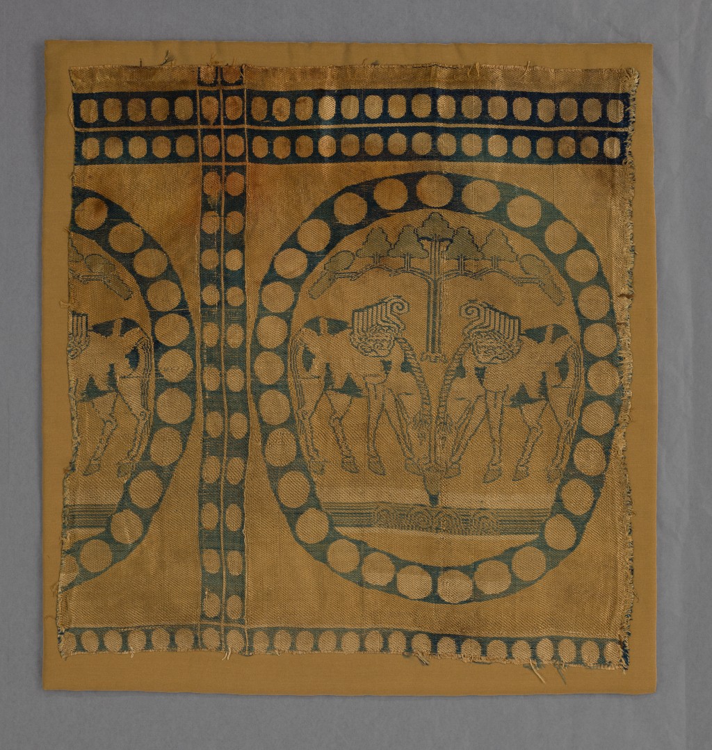 Piece with a pair of facing horses and tress in a pearl roundel Tang dynasty, 7th to 8th century Weft-faced compound twill (samite), polychrome silk threads The Chris Collection at the Hong Kong Palace Museum, 2025.CH-HKPM.51
