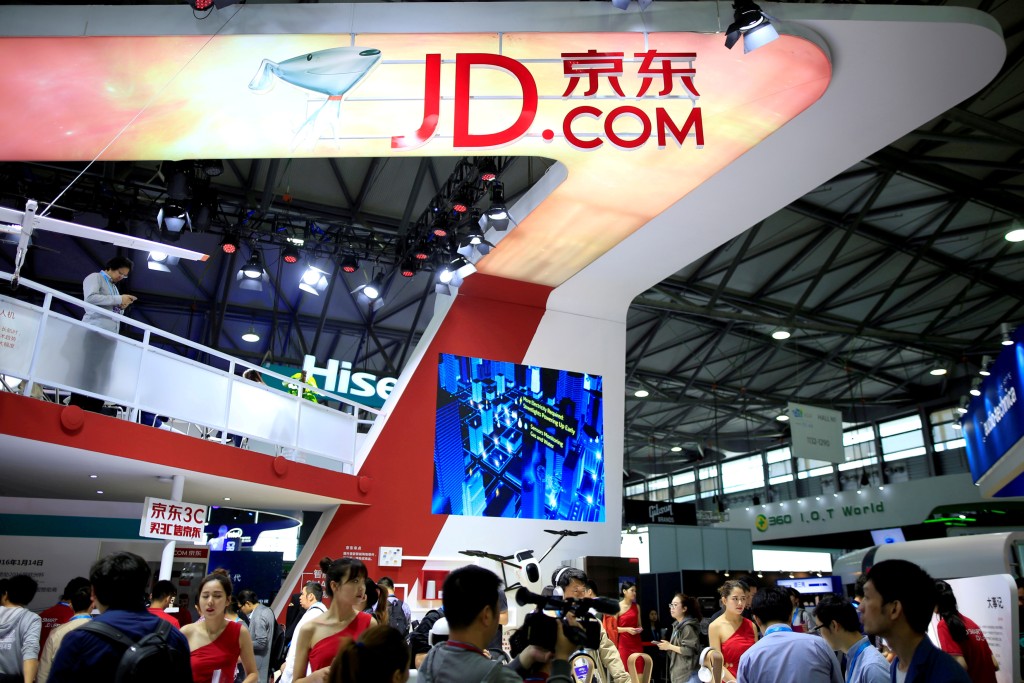 A sign of China's e-commerce company JD.com is seen at CES (Consumer Electronics Show) Asia 2016 in Shanghai. REUTERS