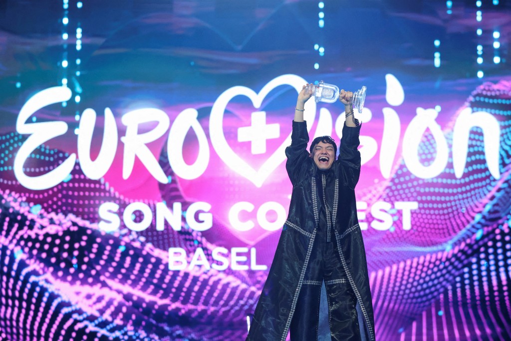 JJ, representing Austria with "Wasted Love", winner of the 2025 Eurovision Song Contest, holds the trophy during the Grand Final, in Basel, Switzerland, May 18, 2025. (Reuters)