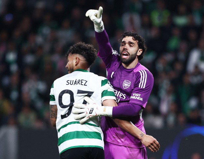 David Raya, with Sporting’s Luis Suarez, made three vital saves to keep Arsenal in the game. REUTERS