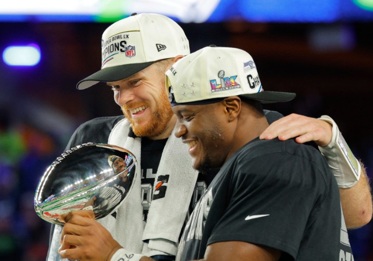 Seattle Seahawks' Sam Darnold, left, and Kenneth Walker III celebrate with the Vince Lombardi Trophy.  AFP