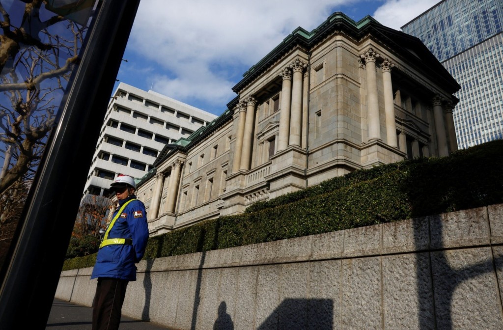A security guard stands in front of the Bank of Japan headquarters in Tokyo, Japan December19, 2025. REUTERS
