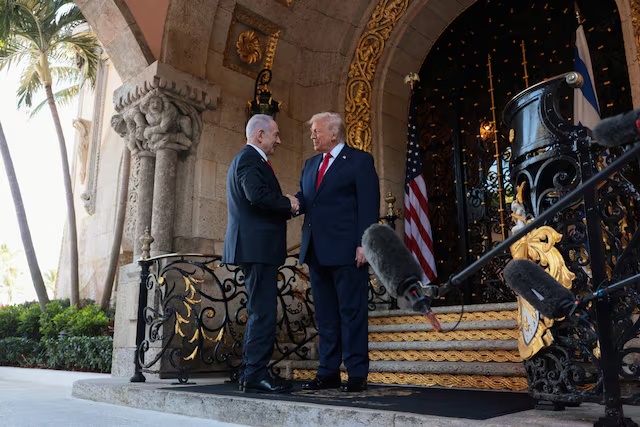U.S. President Donald Trump greets Israeli Prime Minister Benjamin Netanyahu upon arrival for meetings at Trump's Mar-a-Lago club in Palm Beach, Florida, U.S., December 29, 2025. REUTERS/Jonathan Ernst/ File Photo