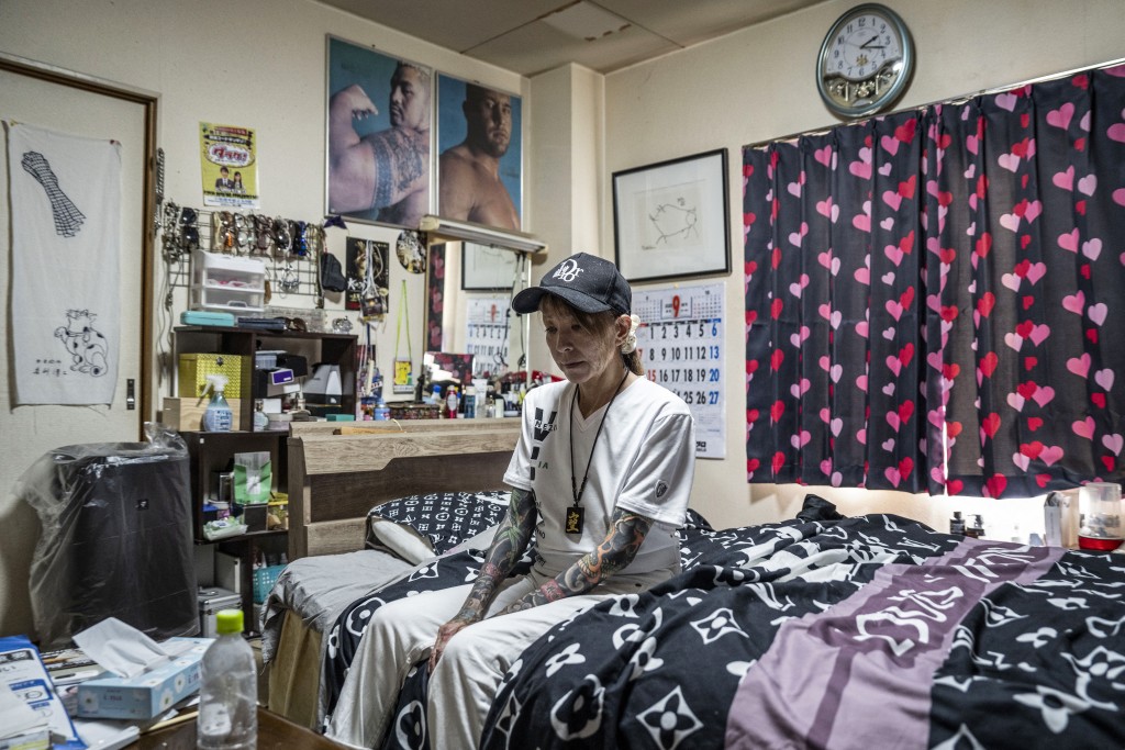 Photo by YUICHI YAMAZAKI / AFP  In this photograph taken on September 28, 2025, retired yakuza Mako Nishimura poses during an interview with AFP at her residence in Gifu.