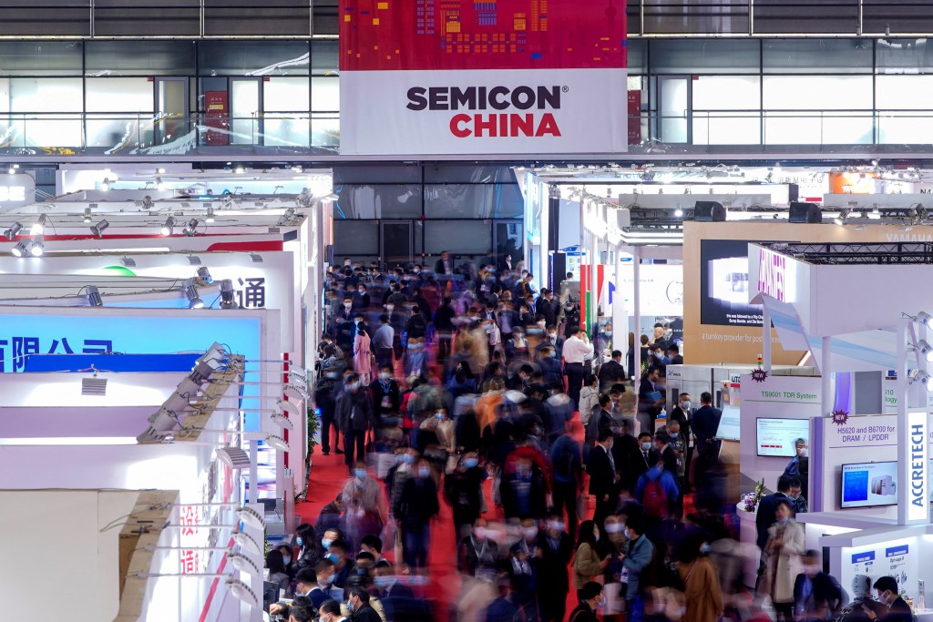 People visit Semicon China, a trade fair for semiconductor technology, in Shanghai, China March 17, 2021. REUTERS