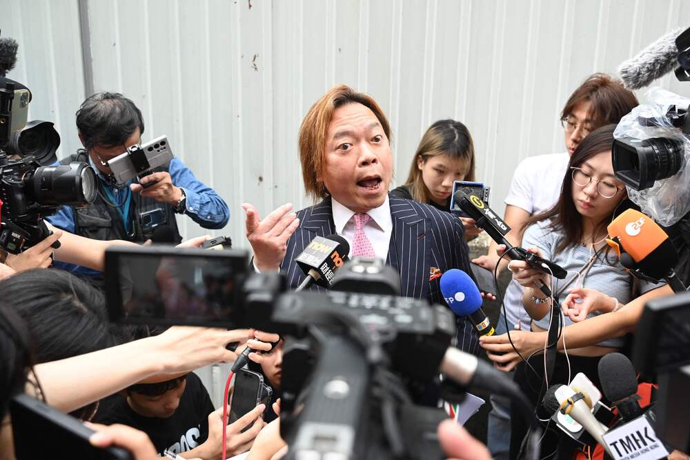 Lawrence Yau and Lee Yue-shun, right, leave the court after they were acquitted. AFP, SING TAO Lawrence Yau and Lee Yue-shun, right, leave the court after they were acquitted. AFP, SING TAO