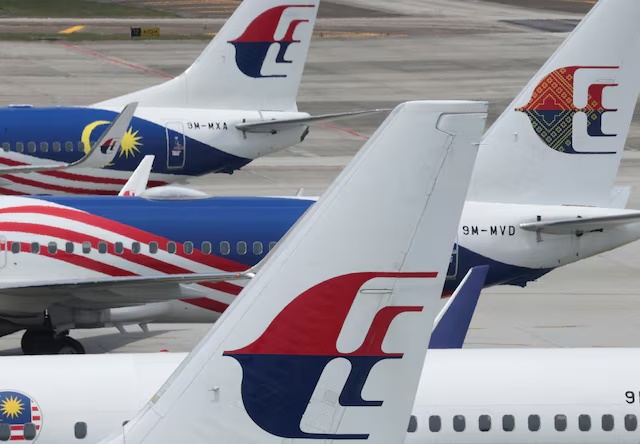 The logo of Malaysia Airlines is seen on its planes parked at Kuala Lumpur International Airport in Sepang, Malaysia August 28, 2024. REUTERS/Hasnoor Hussain