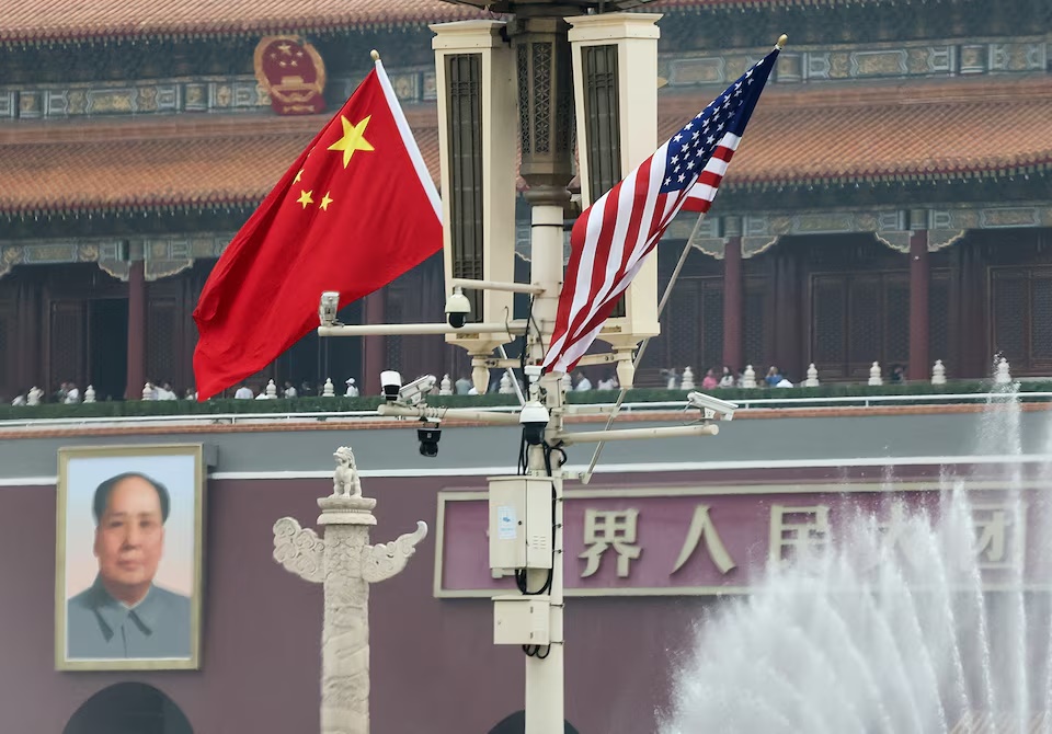 U.S. and China’s national flags flutter next to the Tiananmen Gate featuring a portrait of China’s late Chairman Mao Zedong, during U.S. President Donald Trump's visit to China, in Beijing, China, May 15, 2026. REUTERS/Maxim Shemetov 