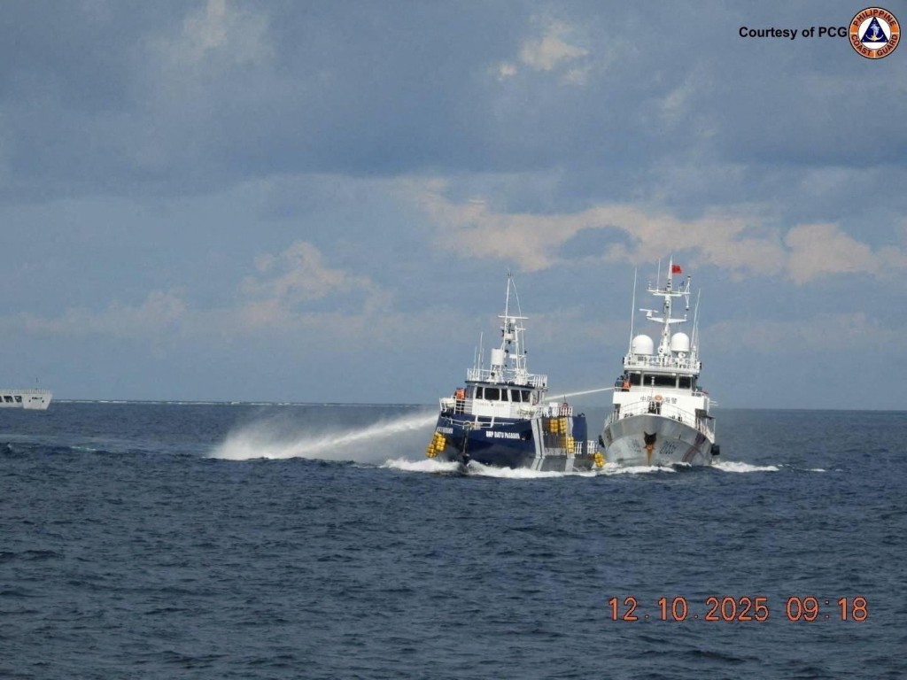 A China Coast Guard vessel 21559 uses a water cannon against Philippines Bureau of Fisheries and Aquatic Resources ship BRP Datu Pagbuaya in the South China Sea, in this handout image released by the Philippine Coast Guard on October 12, 2025. (Reuters)