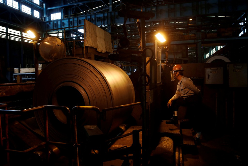 Worker inspects a roll of steel inside the China Steel Corporation factory, in Kaohsiung, southern Taiwan August 26, 2016. REUTERS
